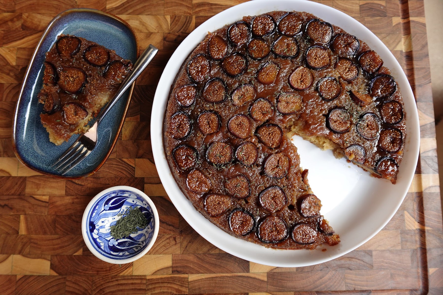 Upside-down fig olive oil cake with caramelized fresh figs arranged in a spiral on top