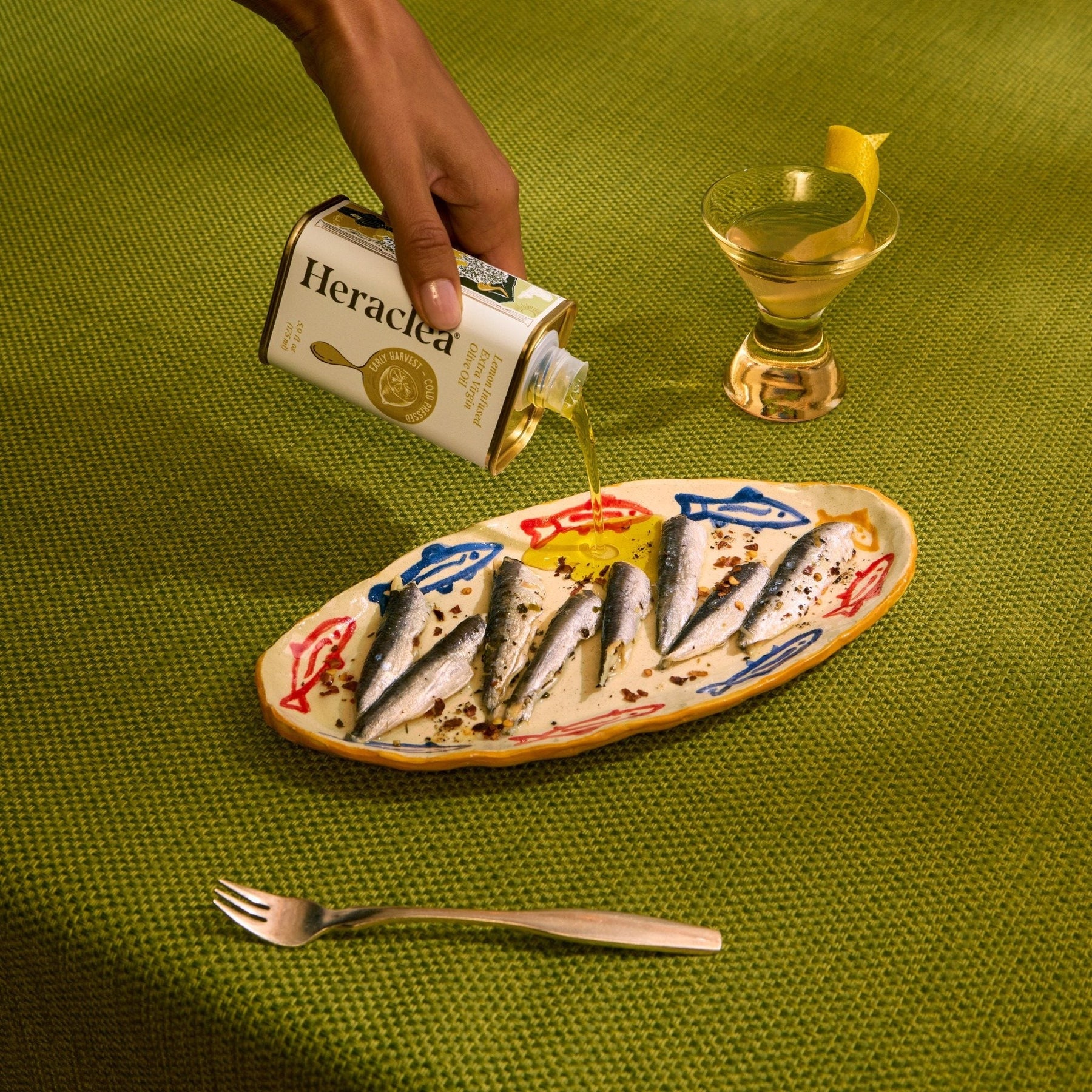 Sardines and lemon dressed with Heraclea extra virgin olive oil — the kind of everyday Mediterranean dish that uses real EVOO generously, the way it's meant to be used.