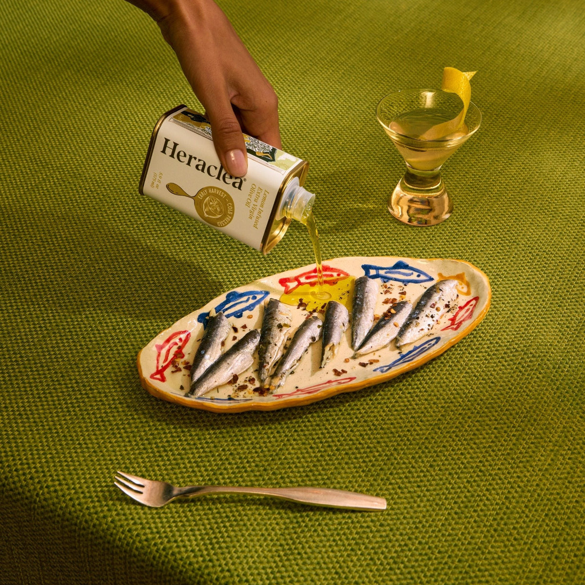 Sardines and lemon dressed with Heraclea extra virgin olive oil: the kind of everyday Mediterranean dish that uses real EVOO generously, the way it's meant to be used.